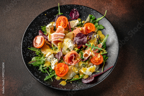 Top view gourmet salad with prosciutto and cheese