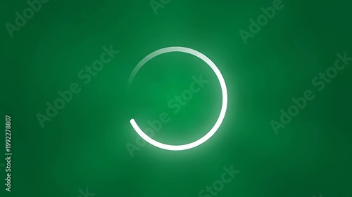 Glowing white circle on green background.