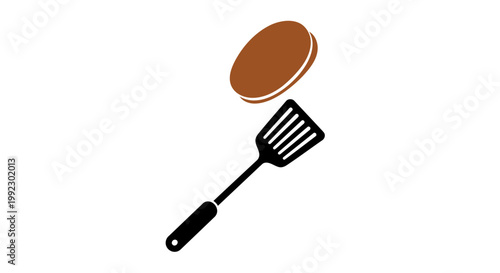 Burger and spatula cooking utensil.