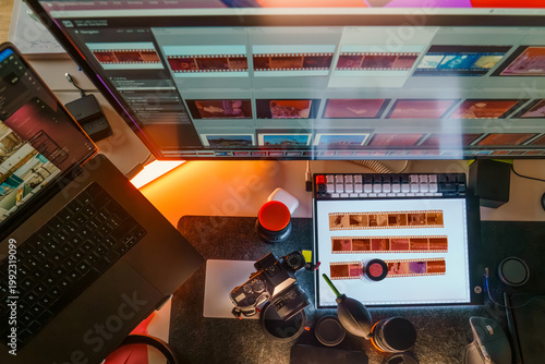 Photographer workspace monitor lightroom software interface film strips light table