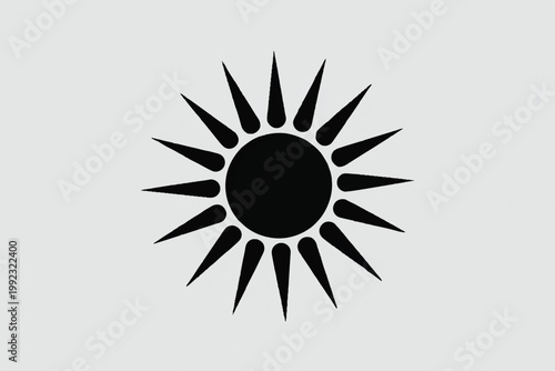 A simple black sun symbol on a light gray background