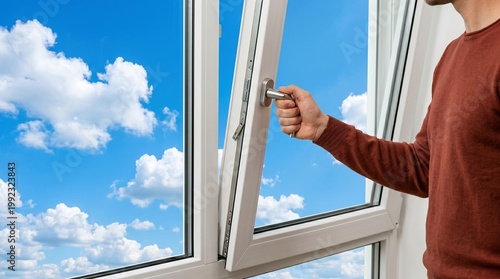 Man opening a white plastic window to see blue sky with clouds. Concept of fresh air, room ventilation and new opportunities. Home interior repair and improvement technology.