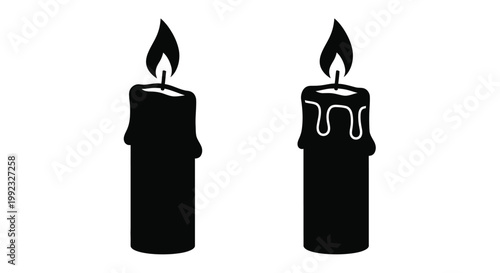 Two black candles with flickering flames a striking silhouette