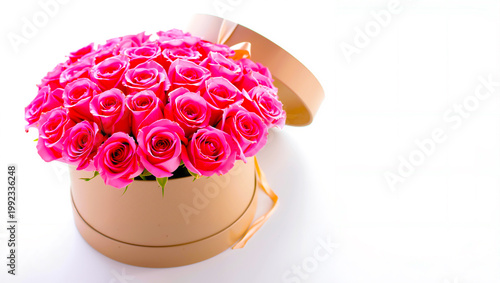 Pink roses arranged in a round box on white background.  Copy space  