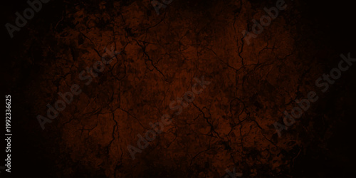 Dark reddish brown grunge texture background with cracked earth patterns and black vignette frame for spooky designs