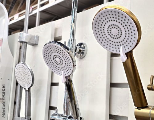 A close-up view of new shower heads on display