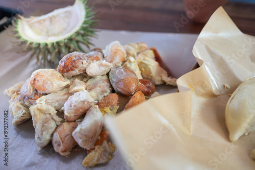 Delicious Durian Fruit and Seeds Served at a Buffet in a Vibrant Market Setting