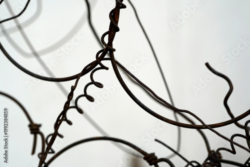 Close-up of tangled and twisted wires forming an abstract chaotic composition