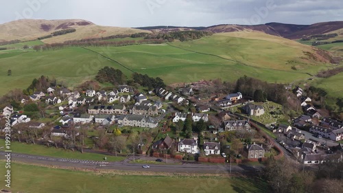 Idyllic Scottish village scenery in Eddleston with traditional cottages integrated into the natural rural landscape of the borders