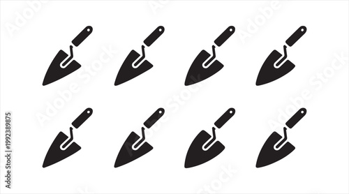 Masonry hand tool symbols set showing plastering and bricklaying trowels in minimal design