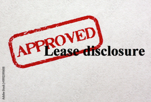 Approved Lease Disclosure Stamp on Paper Document for Real Estate Rental Approval and Contract