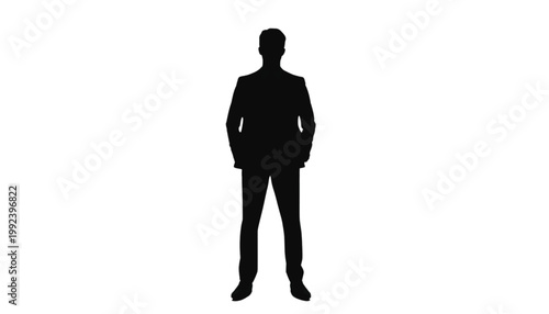 Businessman stands in a formal suit while looking forward with a confident and professional posture.
