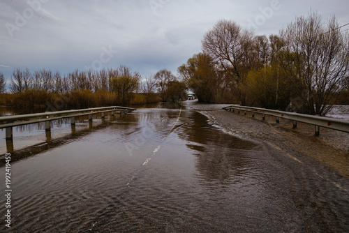 Flooded road after heavy rain or flood of river