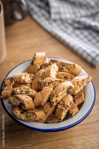 Homemade Italian Biscotti Cookies cantuccini in Enamel Bowl on Rustic Wooden Table for Coffee Snack