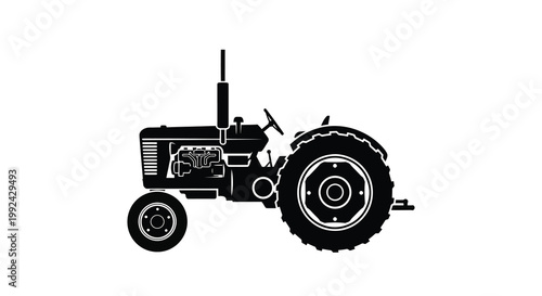 Simple black silhouette of a vintage farm tractor side view