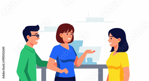 Three people discussing in an office setting.