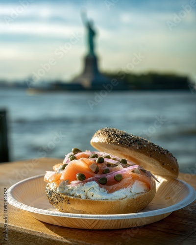 Enjoying an everything bagel with cream cheese and salmon