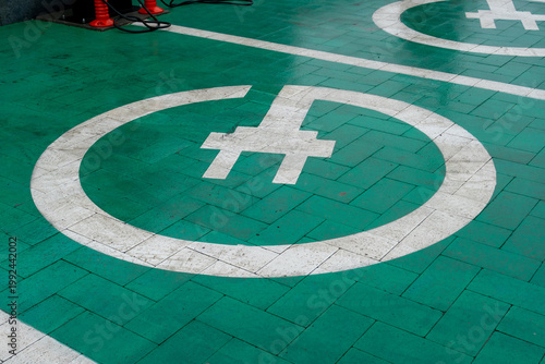 Tableau sur toile Electric Vehicle Charging Station Markings on Floor in a Parking Area During Day