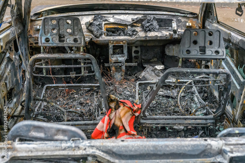 Burnt car interior reveals the aftermath of a destructive fire incident