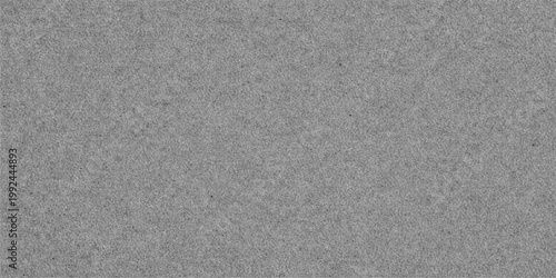 Textured grey backdrop, a subtle grainy surface with an overall muted tone, lending a contemporary ambiance. 