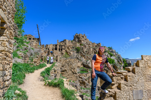 Man Exploring the Ancient Ruins of Gamsutl, Dagestan, Russia