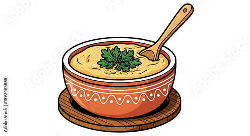 Creamy chicken soup (chicken cream) in a decorated ceramic bowl, finished with a fresh parsley leaf in the center.