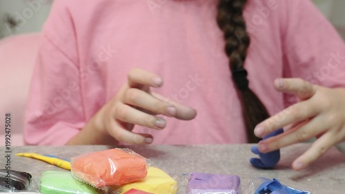 Little girls sculpt figurines crafts from air plasticine, modeling dough. Online lessons in tablet. Children's creativity hobby developing activities, training, learn of fine motor skills of hands.