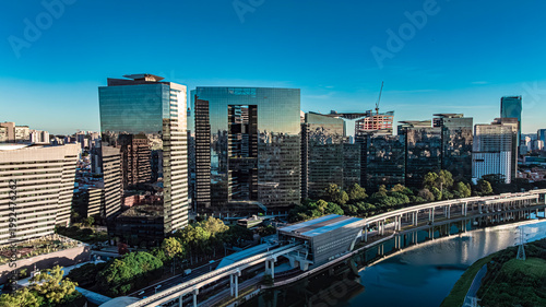 Cuadro en lienzo Aerial view of Pinheiros River and Berrini financial district skyscrapers at sun