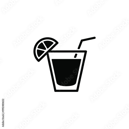Cocktail glass with a lime slice and straw represents a refreshing summer drink.