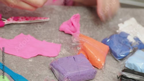 Little girls sculpt figurines crafts from air plasticine, modeling dough. Online lessons in tablet. Children's creativity hobby developing activities, training, learn of fine motor skills of hands.