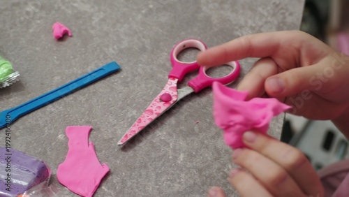 Little girls sculpt figurines crafts from air plasticine, modeling dough. Online lessons in tablet. Children's creativity hobby developing activities, training, learn of fine motor skills of hands.