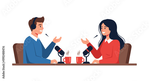 Two people talking at a table with microphones.