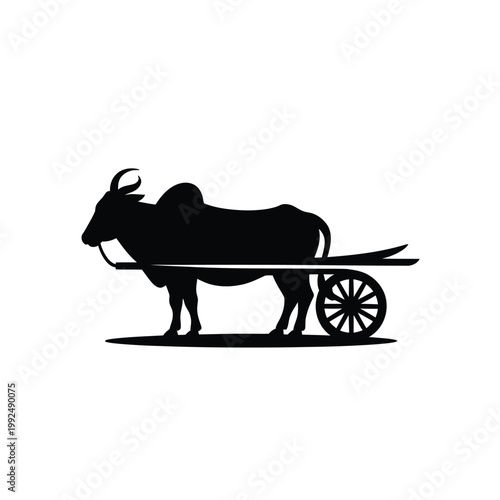 Silhouette of a water buffalo pulling a traditional wooden cart