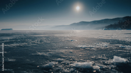 Frozen Lake under the Sun: An expansive, ice-covered lake stretches towards the horizon, where the sun casts a shimmering glow, painting a scene of serene coldness and natural beauty.