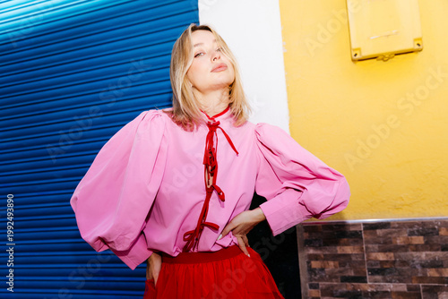 Blonde woman  in colorful street clothes