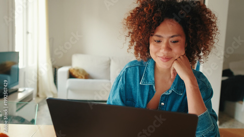 Casual Woman Working On Laptop At Home