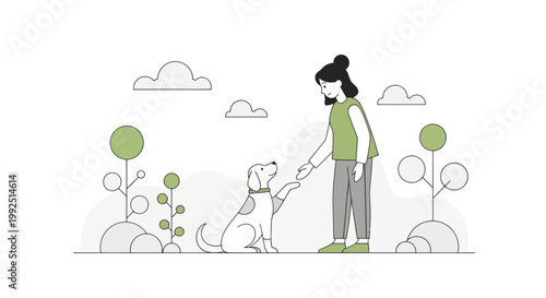 Woman training her dog to shake hands in a park.