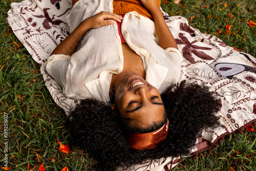 Top-Down View of Woman Relaxing on Blanket