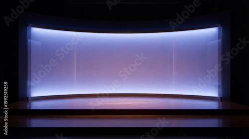 Modern empty presentation stage with smooth floor and gentle backlight for elegant visual impact
