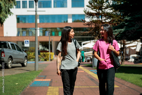 Healthcare professionals walking on campus