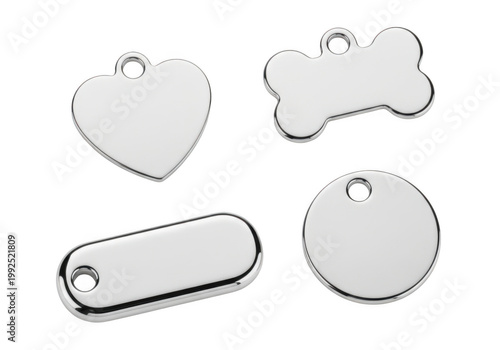 Polished silver pet ID tags collection, blank metal dog name plates for engraving, shiny chrome pet collar charms in heart bone and circle shapes, stainless steel identification pendant set.