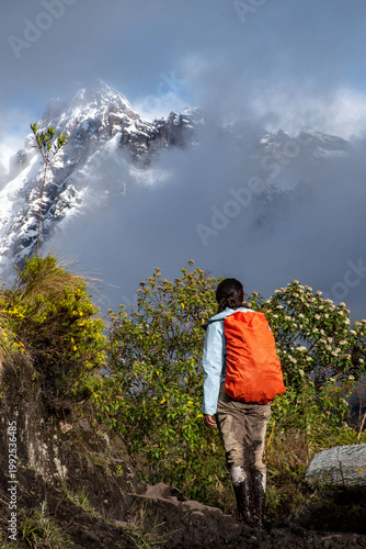Hiker approaching snow mountain
