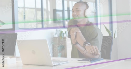 Office worker at laptop glancing wrist checking watch stretching purple or green streaks sweeping de