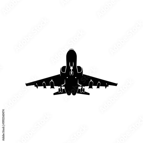 Silhouette of a large passenger airplane flying, viewed from front