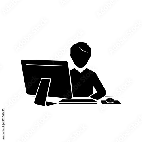 Silhouette of person working on computer, keyboard and mouse on desk
