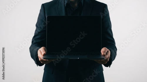 Businessman Presenting Open Laptop With Blank Screen.
