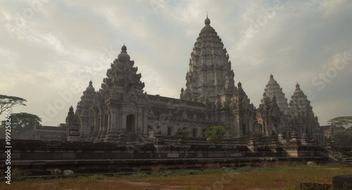 Majestic ancient temple complex under overcast skies, showcasing detailed architecture