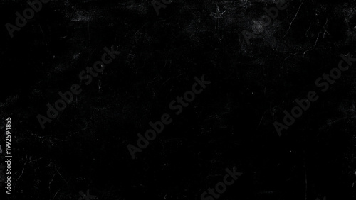 Black marble textured surface with white veins and scratches