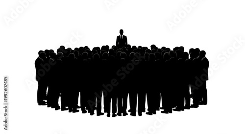 Silhouette of a large group of people standing in a circle with one person standing.