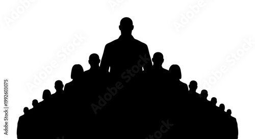 Silhouette of a man standing on a hill with a crowd of people.